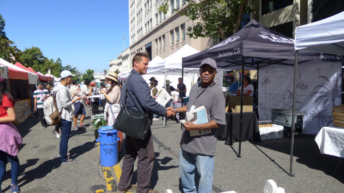 Man selling newspaper